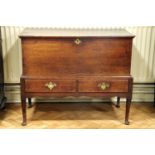 An 18th Century joined oak bedding chest on stand, 109 cm x 53 cm x 91 cm