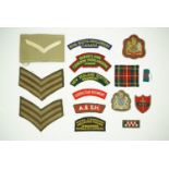 Sundry items of British and Commonwealth cloth insignia including a 14th Army bullion-embroidered