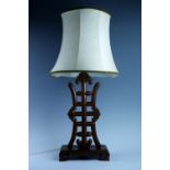 A Chinese carved hardwood table lamp, base 45 cm