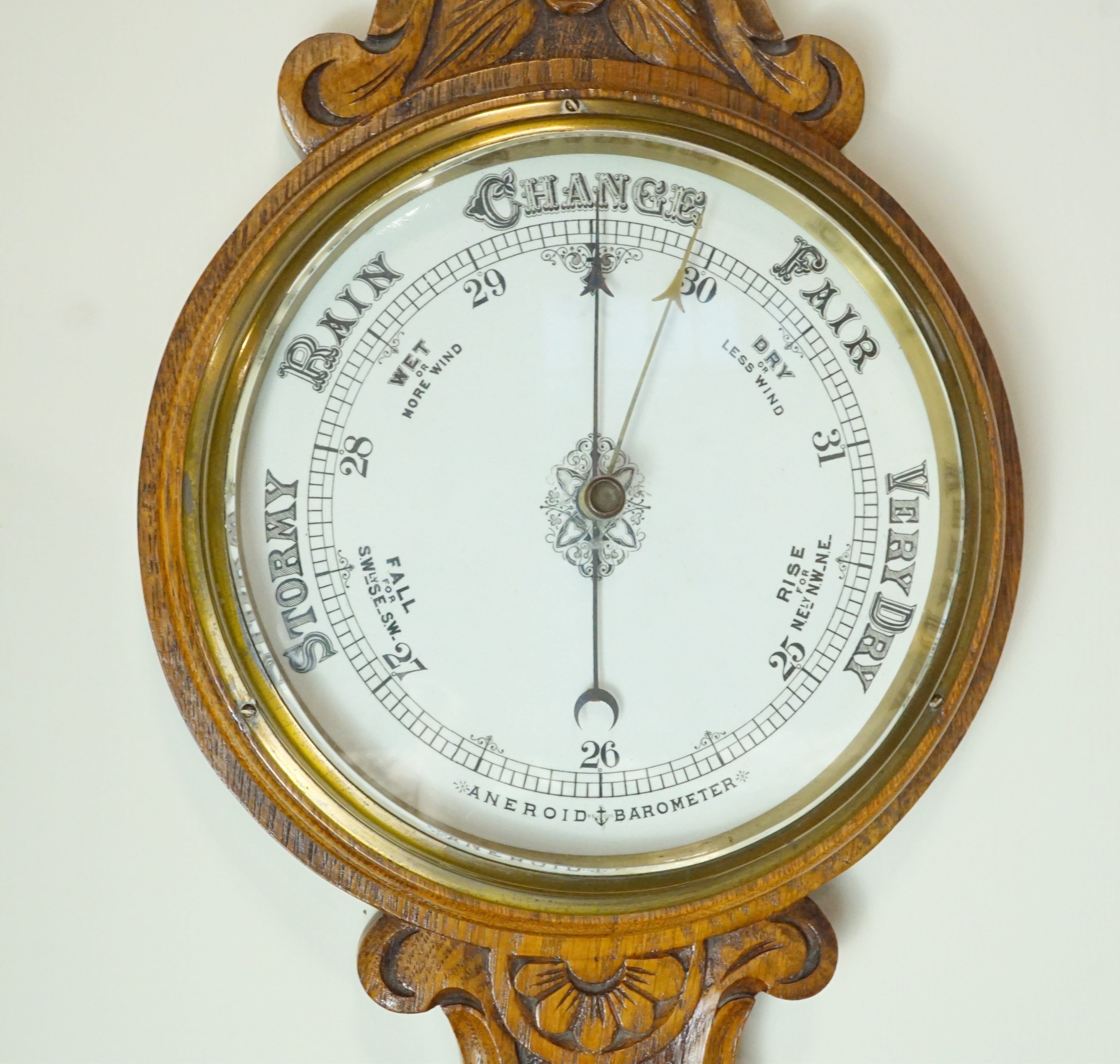 A late 19th / early 20th Century carved oak banjo aneroid barometer, 85 cm - Image 2 of 3