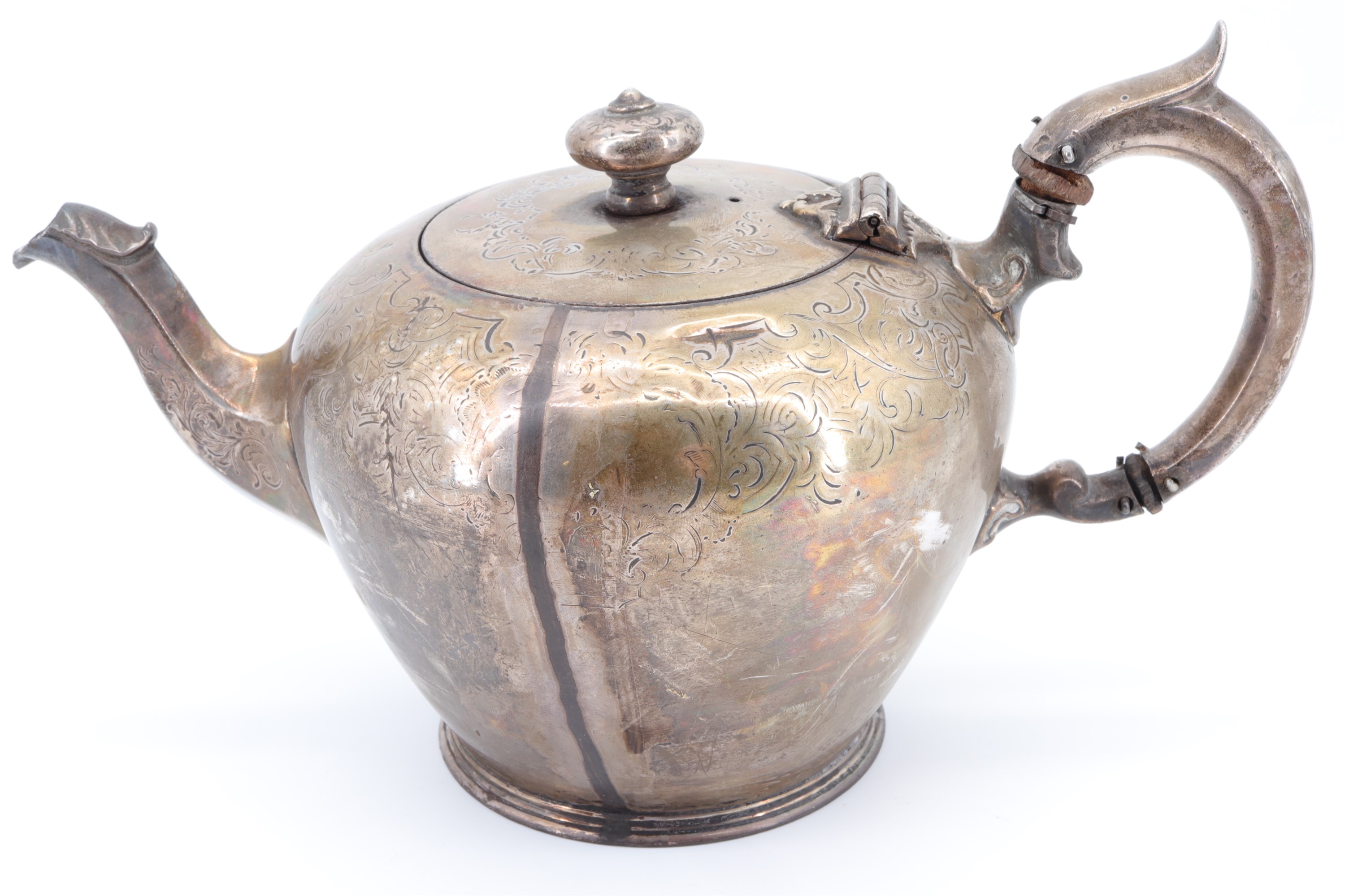 An early Victorian melon form silver teapot, decorated with foliate scrolls, London, 1839, 584 g