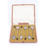 An early 20th Century cased set of six silver coffee spoons, having "bean" terminals, Sheffield,