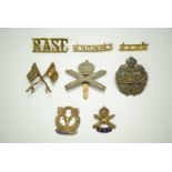 Machine Gun Corps cap badge and sweetheart brooch, together with a Tank Corps cap badges and