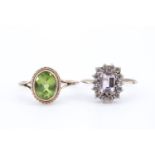 A lady's oval green garnet ring, having an oval stone 6 x 9 mm in a rubbed bezel setting, within a