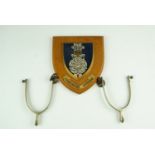 A Yorkshire Hussars plaque together with a set of spurs