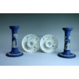 A pair of Wedgwood Jasperware candlesticks, 17 cm, together with a pair of Wedgwood wild flower