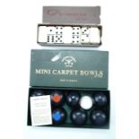 Miniature carpet bowls together with Classico dominoes