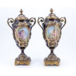 A fine pair of 19th Century porcelain and gilt metal urns in the manner of Sevres , each urn