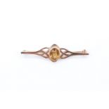 A late 20th Century citrine and 9 ct gold brooch, having an oval brilliant cut stone of