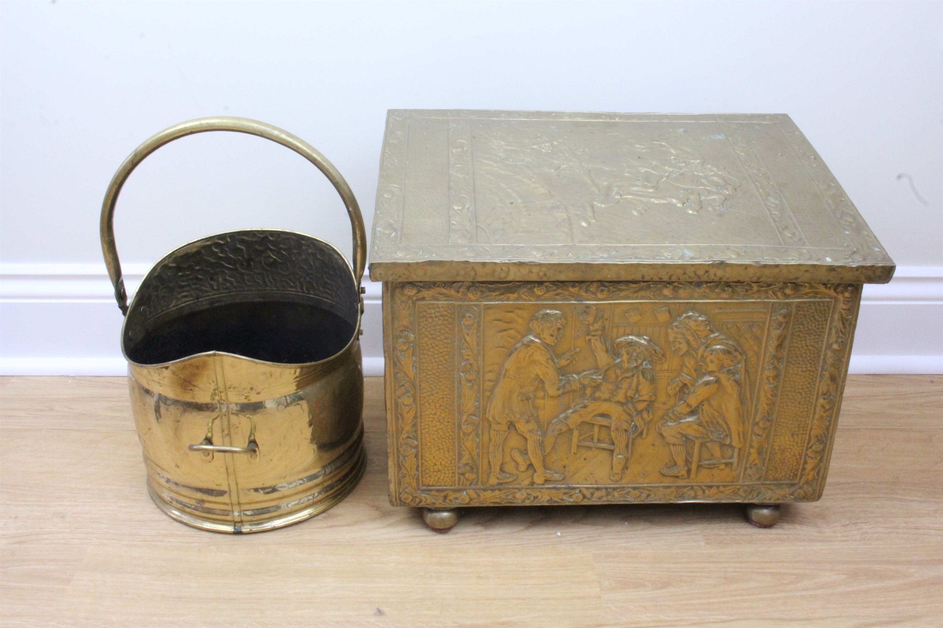 A brass bound log box, bearing scenes from Robert Burns' "Tam o' Shanter", together with a brass