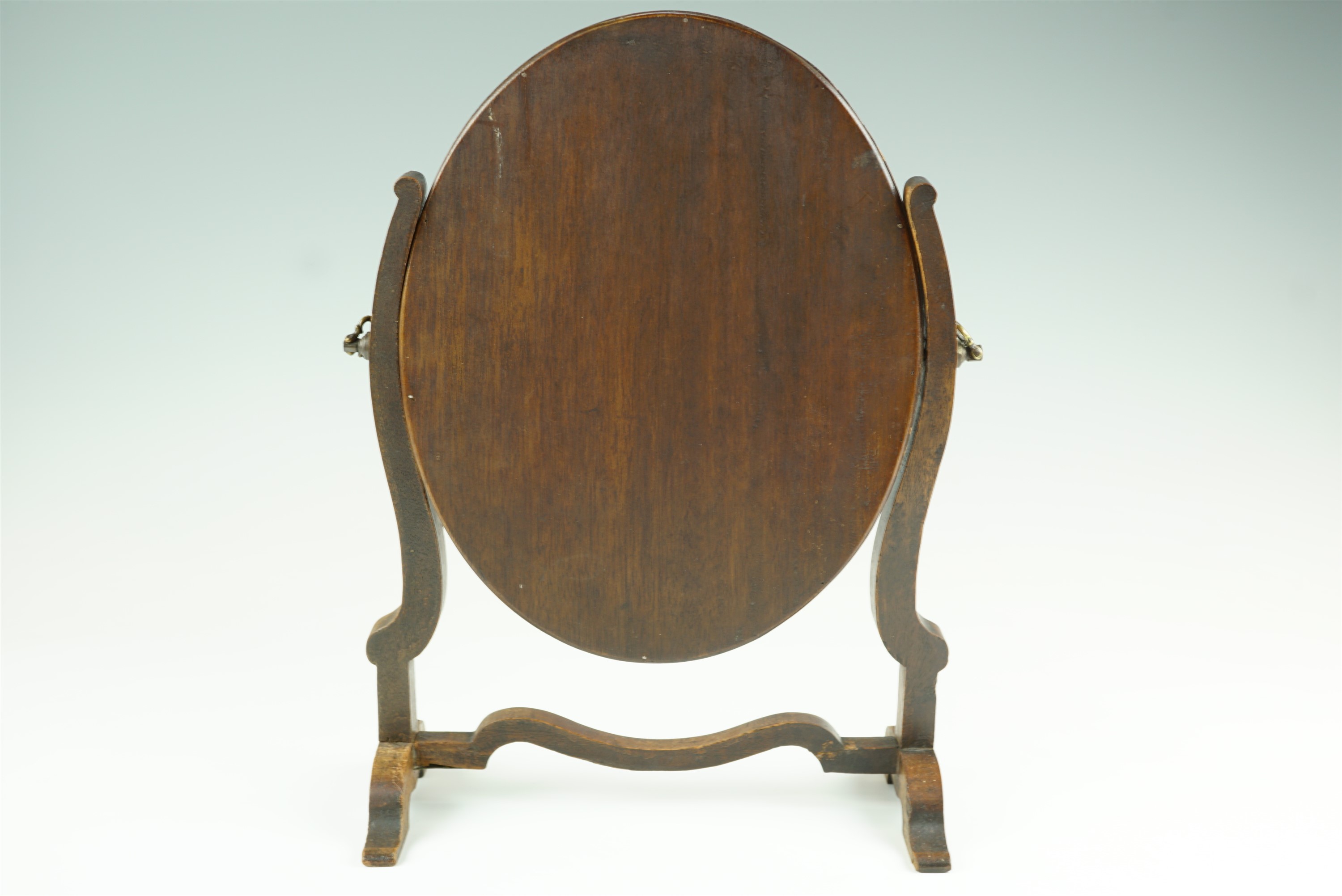 A 19th Century mahogany oval swivel toilet mirror, 27 cm x 37 cm - Image 2 of 2