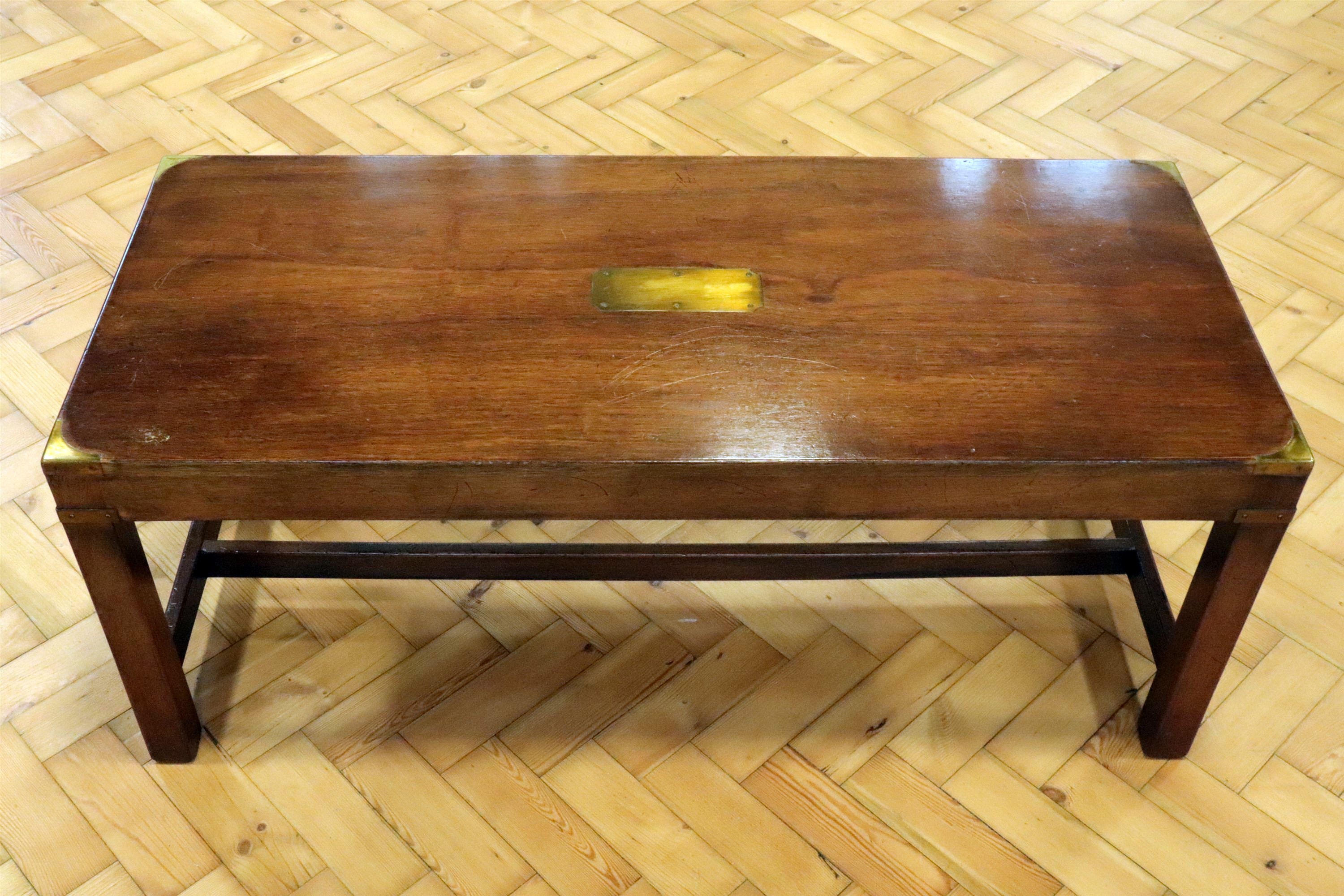 A late 20th Century campaign style brass-mounted mahogany coffee table, 107 cm x 46 cm x 44 cm