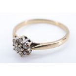 A late 20th Century daisy set diamond ring, having seven 2 mm brilliant diamonds (0.2 carat total)