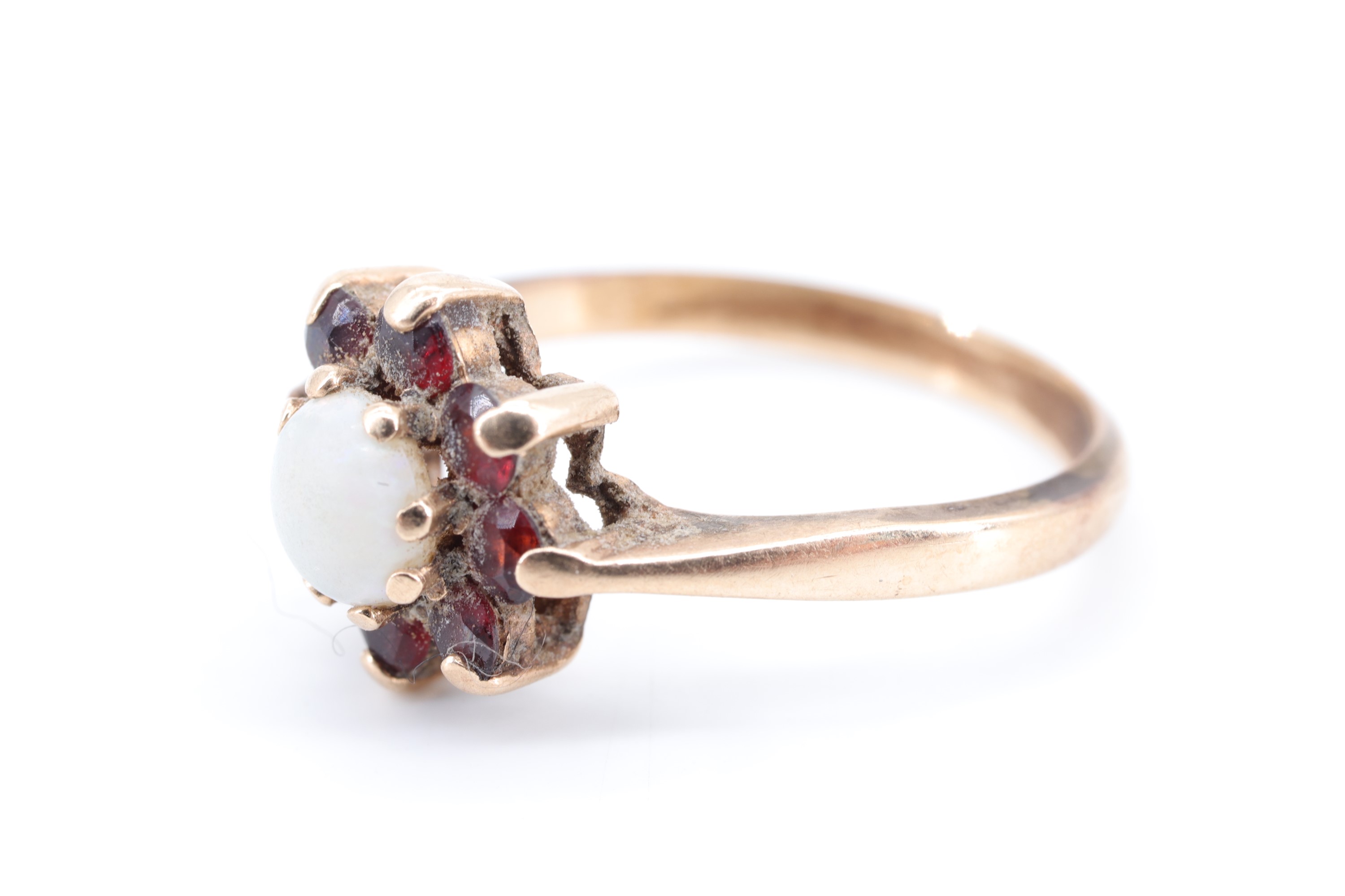 An opal and garnet flowerhead cluster ring, the opal cabochon of 5 mm diameter, set on 9 ct gold, M, - Image 2 of 3