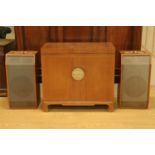 A 1960s Hong Kong retailed teak music cabinet containing a Leak Stereo One Stereo pre-amplifier,