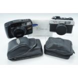 A Samsung Super Lens 38-105mm Super Macro camera, together with a Ricoh 35 FM