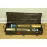 A pair of inert British army practice 105 mm tank gun rounds and ammunition case