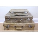 Three early 20th Century faux velum suit cases, together with another similar, largest 71 x 40 x