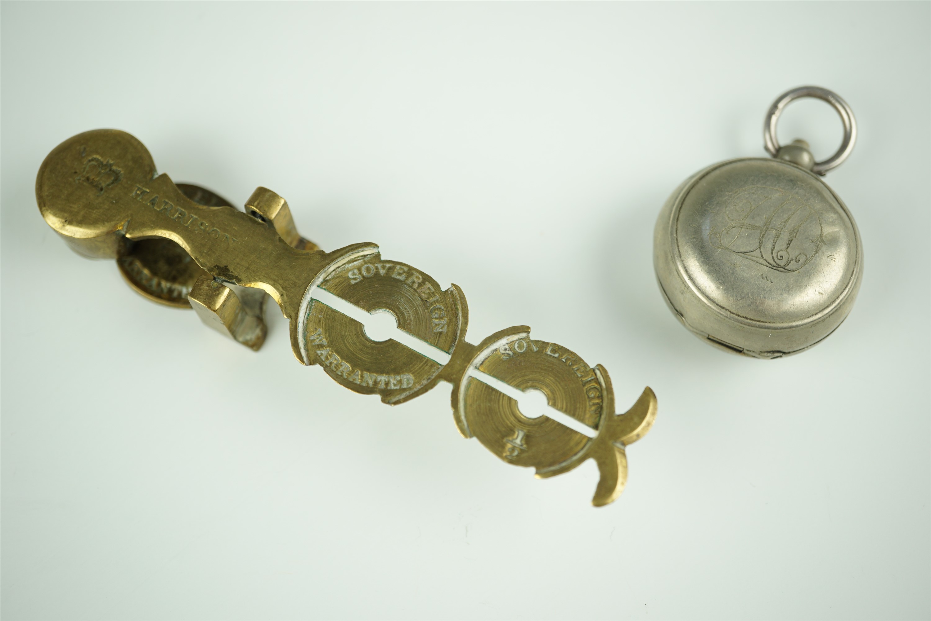 A late 19th / early 20th Century watch chain fob sovereign case, its interior decorated in depiction