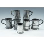 Seven 19th Century pewter pint and other tankards