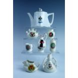Crested china including a Redcar teapot and a Robin Hoods Bay lucky black cat jug