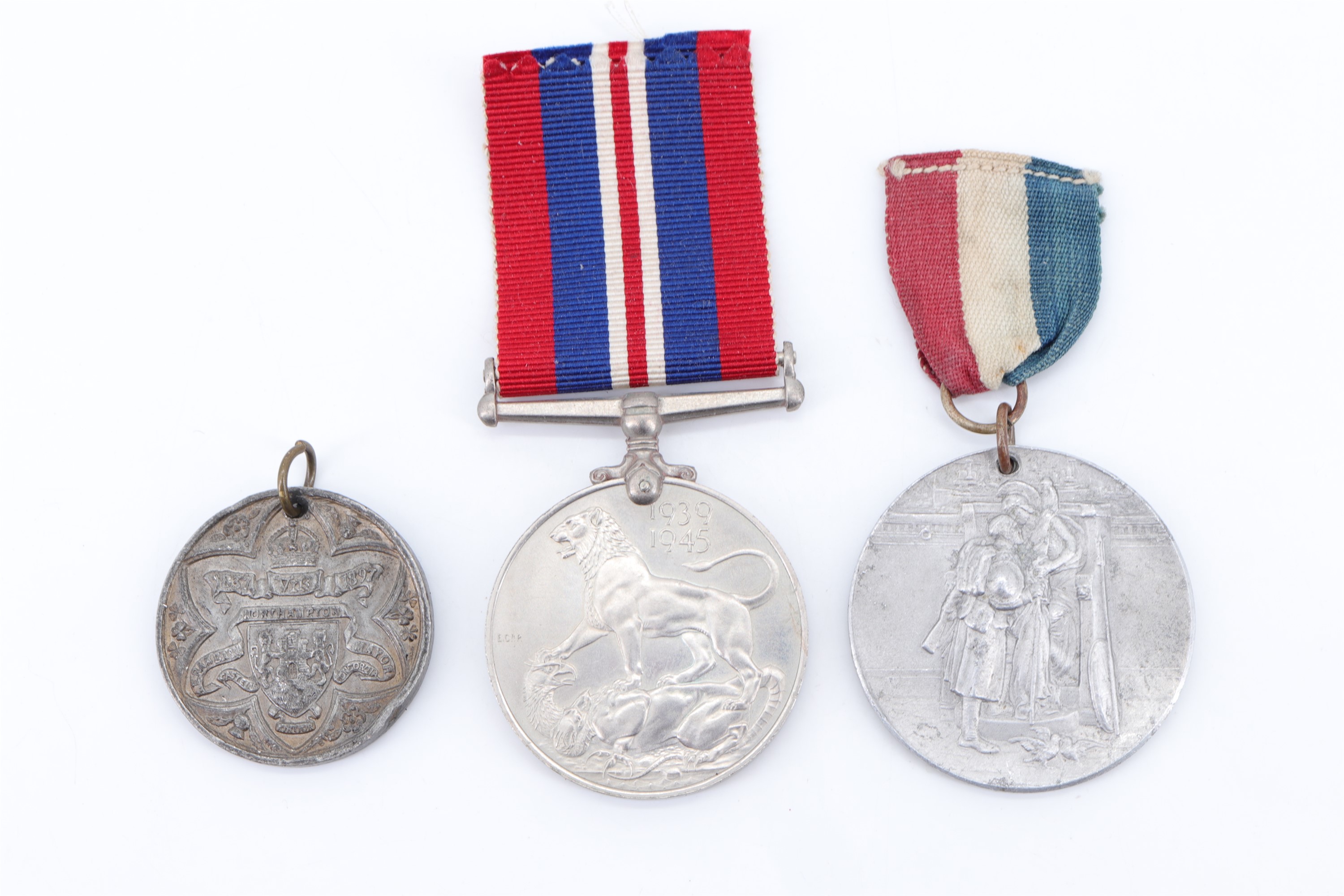 A queen Victoria diamond jubilee medallion together with a City of Carlisle 1919 peace medallion and