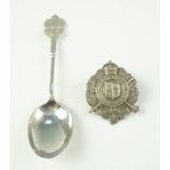 A London Rifle Brigade cap badge, and silver commemorative teaspoon relating to the same,