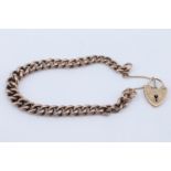 A 9 ct gold chain bracelet with a padlock clasp, having graduated curb links, London, 1963, 19.5 cm,
