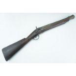 An early 19th Century percussion blunderbuss, having a 14-inch brass barrel with iron foresight, the