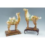 Two Chinese Tang style figures of a horse and a Bactrian camel, with stands, horse 32 cm