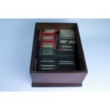 A pine box containing approximately 180 magic lantern slides, depicting a post Great War trench,