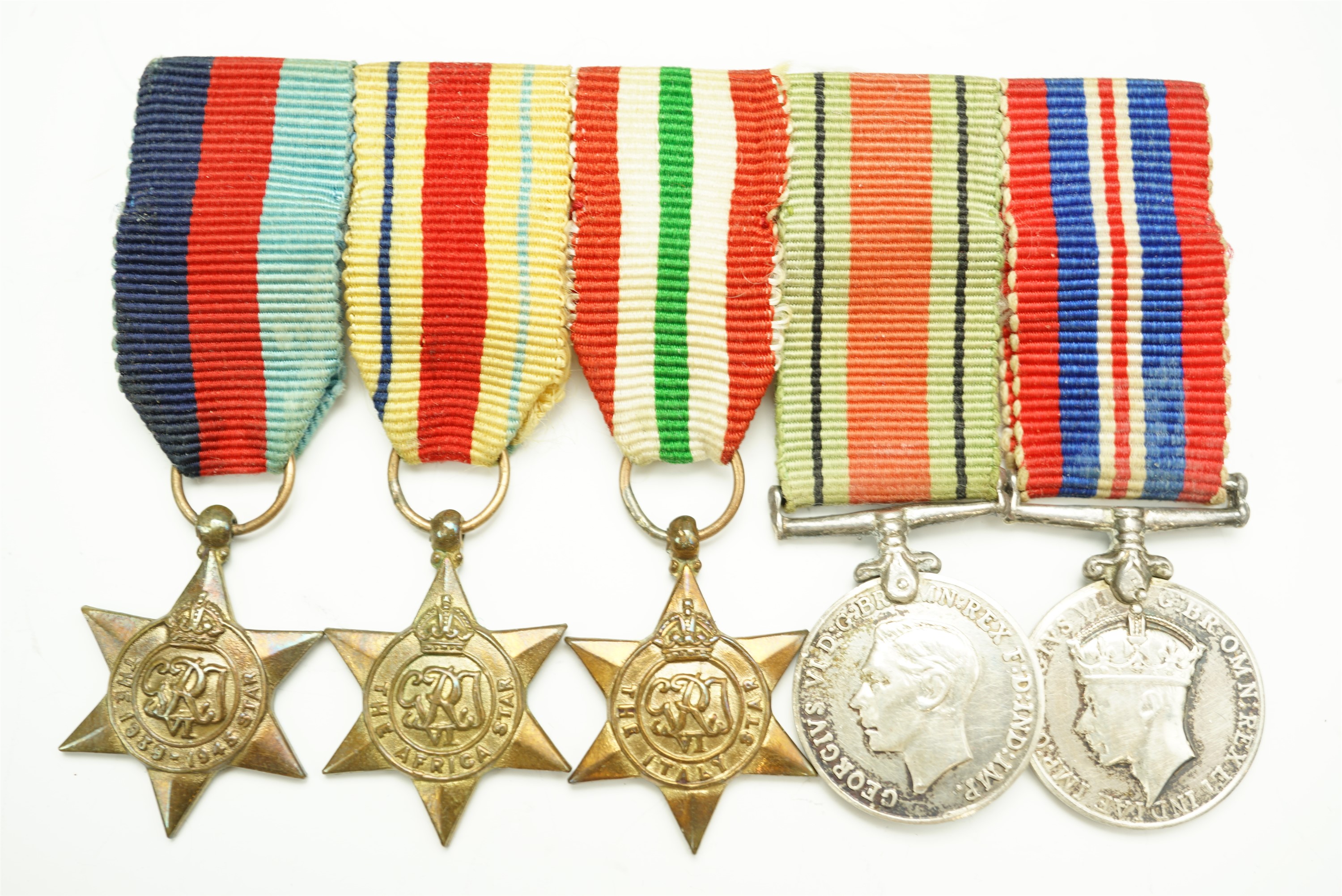 A Second World War miniature campaign medal group together with a quantity of medal ribbon bars etc - Image 2 of 4