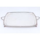 A fine late Victorian silver tea tray, of rounded oblong form, having a gadrooned edge moulding with