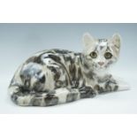 A Winstanley recumbent tortoiseshell cat No. 5, signed, 32 cm