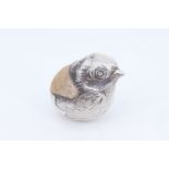 A 1920s (larger variant) novelty silver pin cushion in the form of a chick hatching from an egg,