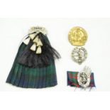 A 1938 silver Seaforth Highlanders territorial battalion sweetheart brooch together with other