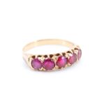 A vintage five-stone ruby ring, comprising round cut stones of approx 1 ct aggregate weight set on a