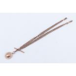 An Edwardian 9 ct rose gold double Albert watch chain and fob, of graduated curb links, having a