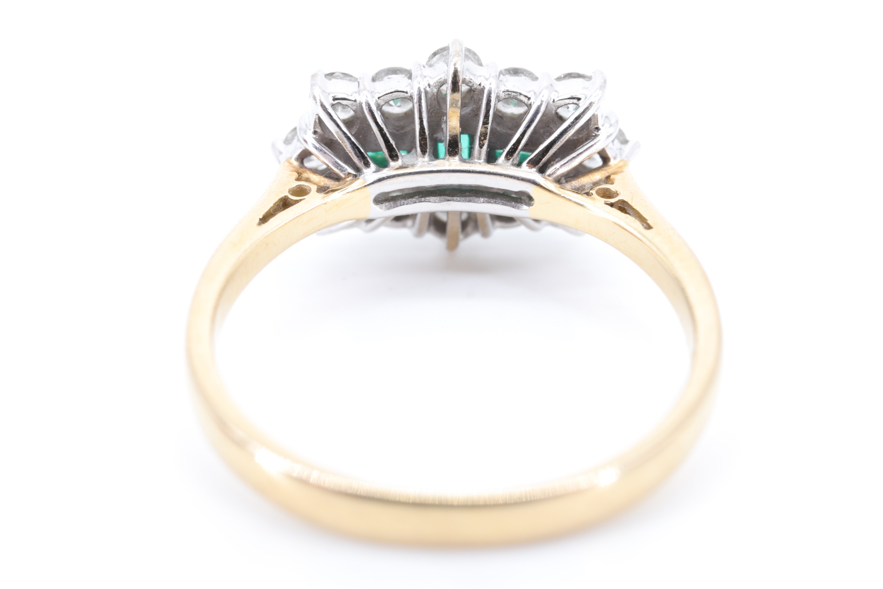 A fine emerald and diamond ring, comprising a pair of baguette-cut emeralds divided by one other set - Image 6 of 6