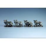 Four late 19th / early 20th Century fair ground shy targets, in cast iron and modelled as lions,