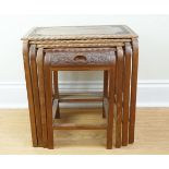 A south Asian carved hardwood nest of four tables, 46 cm x 34 cm x 46 cm