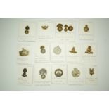 A large quantity of cap badges