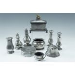 A Victorian pewter tobacco box together with an ink well, tobacco box, bowls and casters /