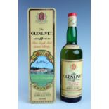 A bottle of Glenlivet pure single malt scotch whisky, in Classic golf courses Muirfield tinplate