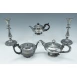 A pair of pewter candlesticks, 23 cm, together with three Britannia metal teapots