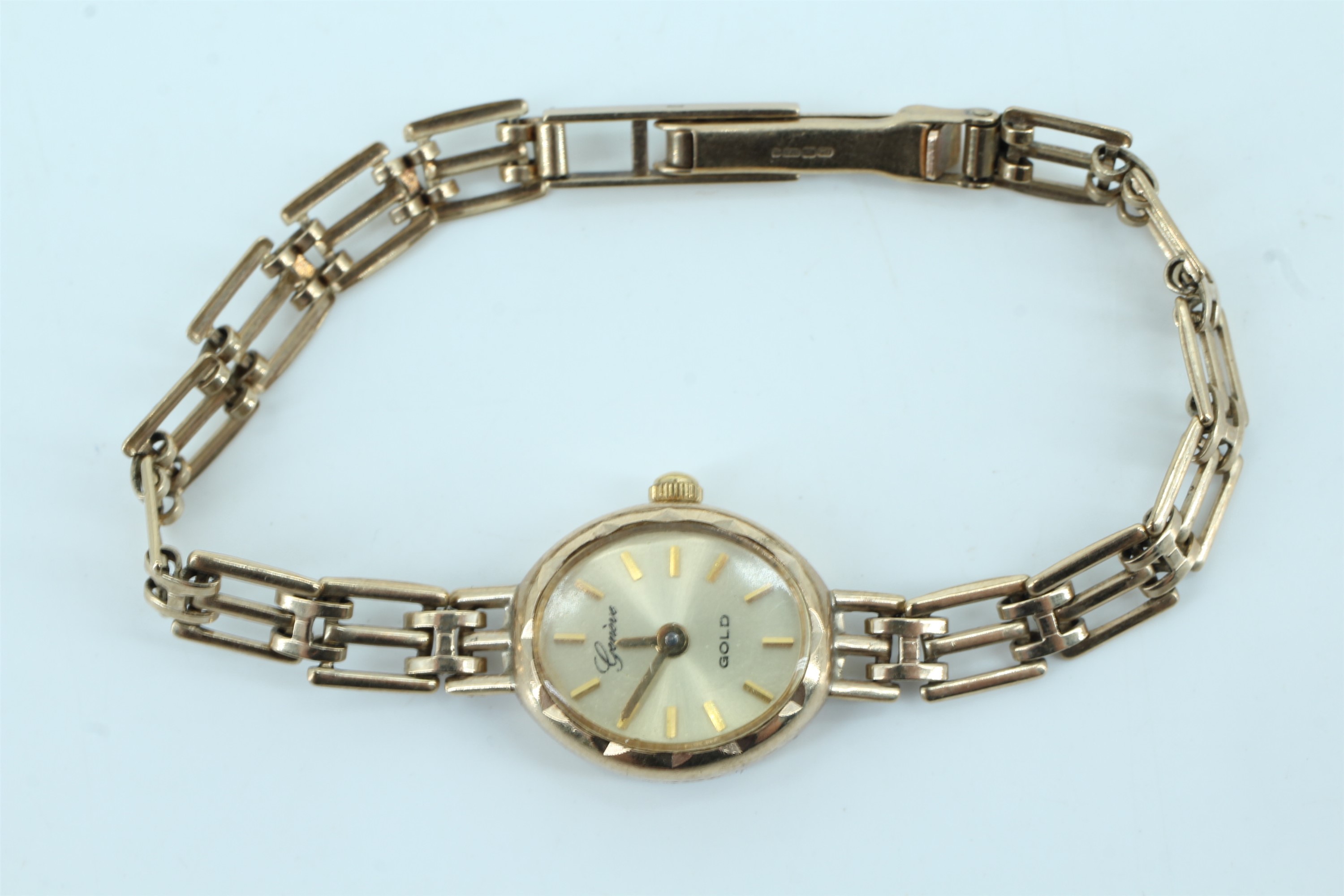 A late 20th Century 9 ct gold Genève wristwatch, having a quartz movement and a gate link 9 ct