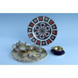 A Royal Crown Derby Imari plate, together with a Royal Doulton cabinet cup and saucer, and a