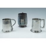Two Royal Anglian Regiment "Weapons Meeting" pewter tankards, together with an electroplate tankard,