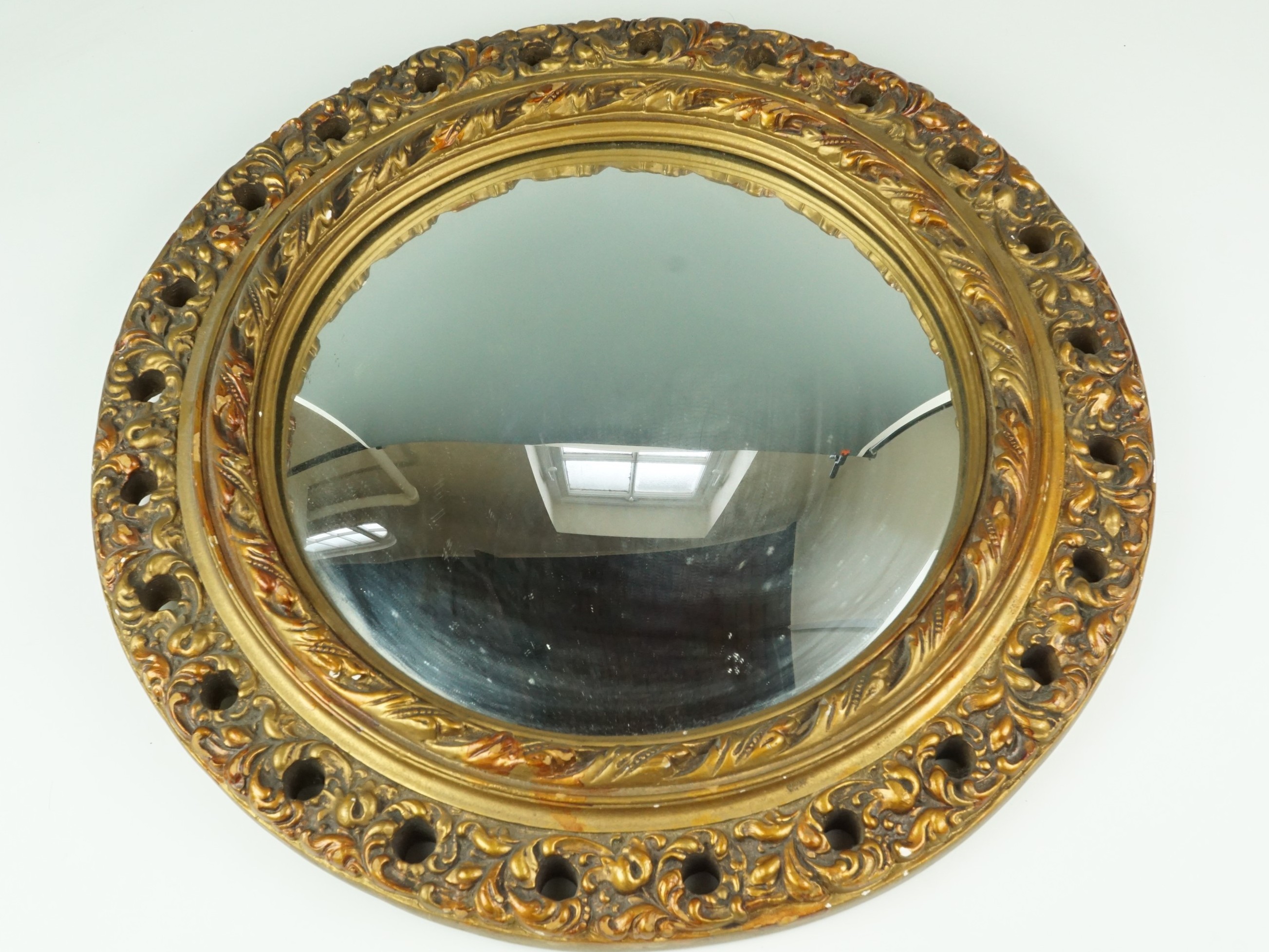 A vintage convex mirror in fancy gilt acanthus leaf frame, 43 cm