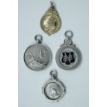 Two 1920s silver fob medals, one for target shooting, a 1930s fire brigade association medal